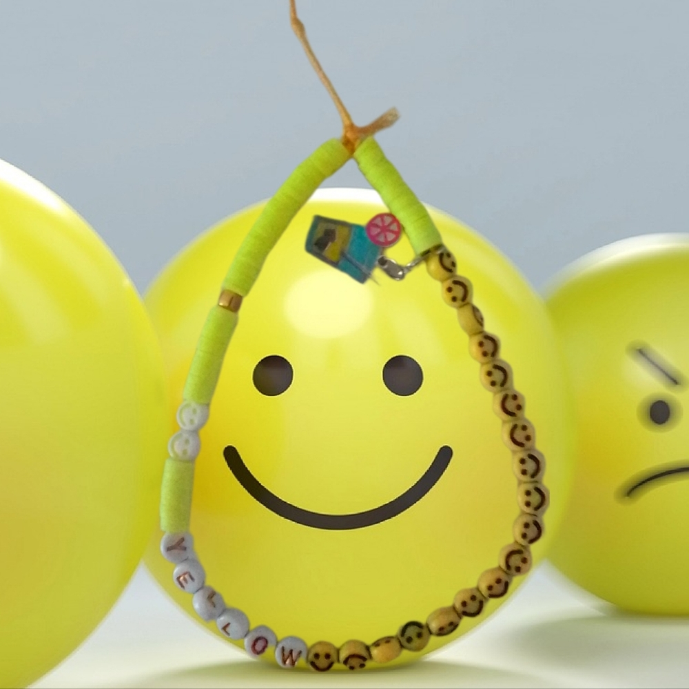 Yellow, Yellow, and yellow phone charm handmade by mxshabeads